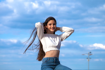 Young beautiful teen girl in blue jeans