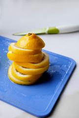 sliced lemon on a blue chopping Board