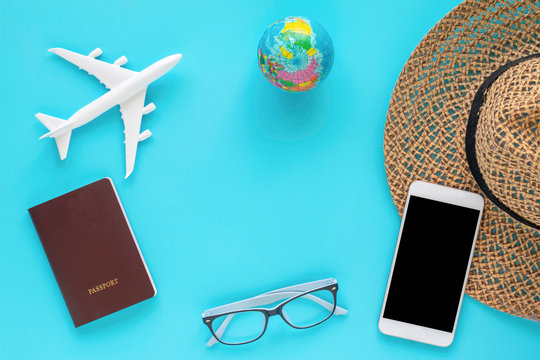 travel objects and accessories on blue background with passport  and plane.