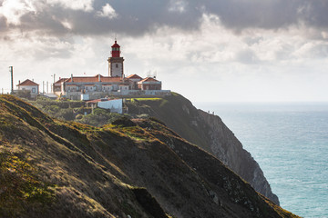 Fototapeta na wymiar Cabo da Roca, lighthouse at the and of the Europe. The most if the west point of the Europe. Cape Cabo da Roca, Portugal.