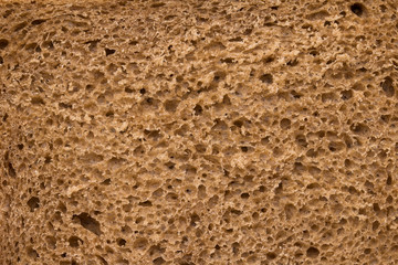 High resolution brown bread texture background. Texture of brown bread baked from rye flour