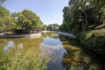 Small pond in Istanbul star park. There are gazebos and cafes around.
