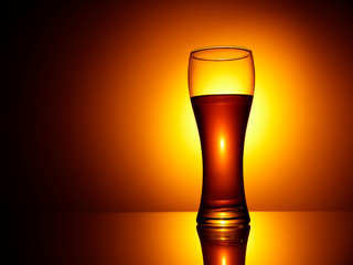 glass of beer on black background