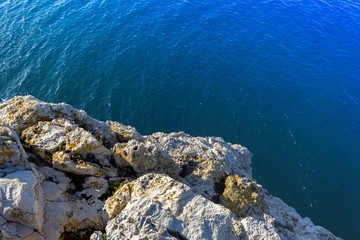 Rocky canyon beach with blue sea