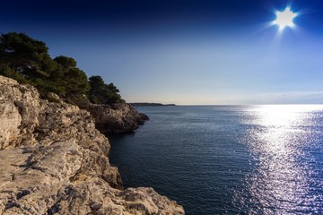 Rocky canyon beach with blue sea