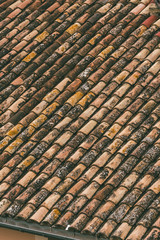 Red roof tiles. Medieval roof texture, aged roof tiles. 