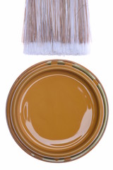 Top view brown paint can with brush isolated on white background