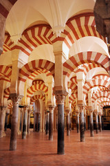 Forest of columns in the famous Mosque of Cordoba (Mezquita de Córdoba) World Heritage Site by Unesco, one of the most visited monuments of Andalusia and Spain.