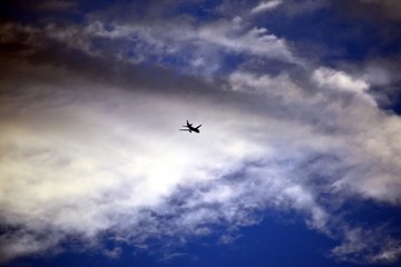Fototapeta na wymiar Airplane Flying through the Clouds
