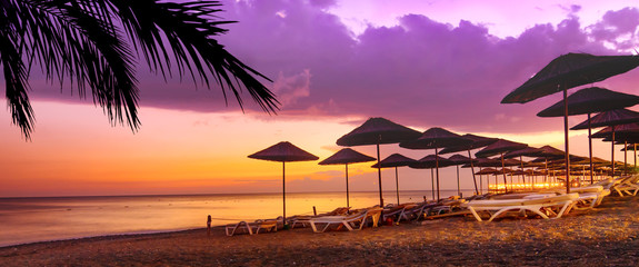 Coral purple sunset on the tropical beach