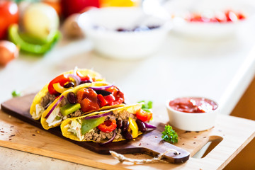 Tacos on cutting board