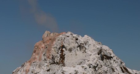 Yellowstone hot geyser waterfall into river. Geyser Yellowstone National Park in Wyoming, United States. Geothermal ecosystem feature. Caldera, super volcano. Biology geography and ecology.