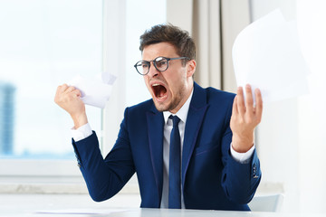 portrait of a businessman showing thumbs up