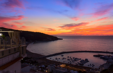 Panoramic view of the bay of Peschici at sunset: the marina and the sandy beach, Italy (Puglia). Peschici is famous for its seaside resorts, its territory belongs to the Gargano National Park.