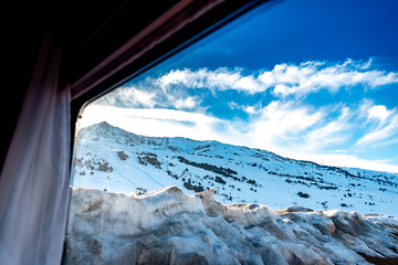 View of the slopes and ski pistes of the Baqueira Beret spanish ski resort through a motorhome RV window