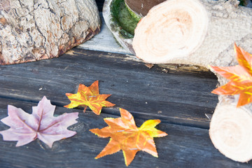 Yellow leaves on a bench in autumn close-up. Natural autumn backdrop