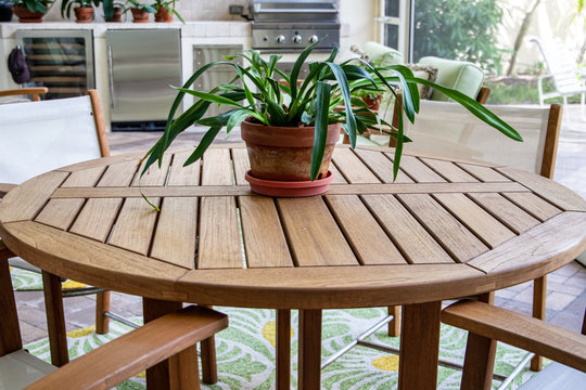 teak table and chairs on outside lanai