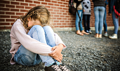 sad intimidation moment Elementary Age Bullying in Schoolyard