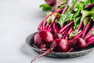 Bunch of fresh raw organic beets with leaves