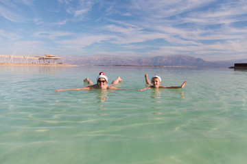 Chrismas family funny mood in dead sea