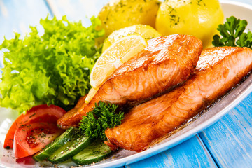 Grilled salmon with boiled potatoes and vegetable salad