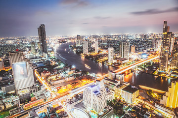 Fototapeta na wymiar aerial night view of Bangkok City skyscrapers Thailand