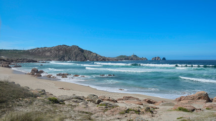 Cape Vilan Lighthouse and Reira beach in Camariñas, Galicia, Spain. First electrical lighthouse in Spain built a few years after the  shipwreck of the HMS Serpent in 1890. 