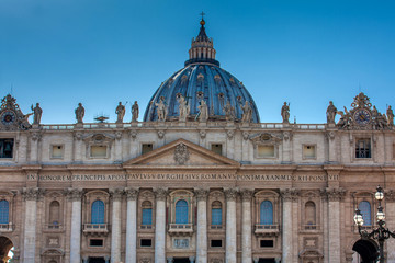 Fototapeta na wymiar Facade and dome of the Papal Basilica of St. Peter in the Vatican