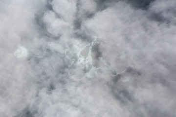 Aerial View from Above of a beautiful rocky beach covered in Clouds and Fog at the West Pacific Ocean Coast. Taken near Tofino and Ucluelet in Vancouver Island, BC, Canada.