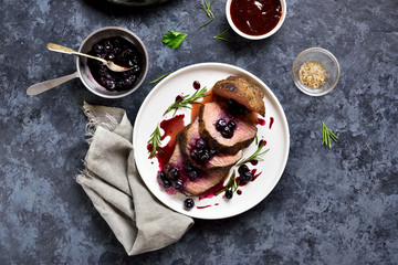 Grilled beef with blueberry sauce