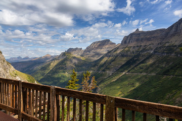 Fototapeta premium Beautiful Panoramic View of American Rockies from a viewpoint during a sunny summer day. Taken in Glacier National Park, Montana, United States of America.