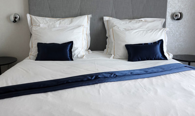 Double bed in bedroom with blue details