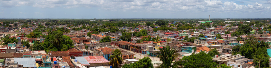 Fototapeta na wymiar Aerial Panoramic view of a small Cuban Town, Ciego de Avila, during a cloudy and sunny day. Located in Central Cuba.