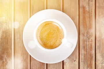 Cup of coffee on wooden background