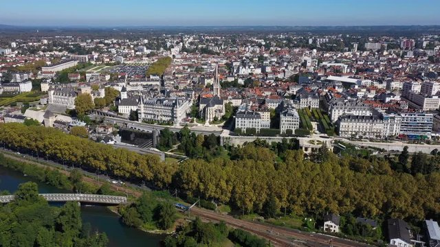 Beautiful aerial view of Pau France train passing along the Gave river castle church 