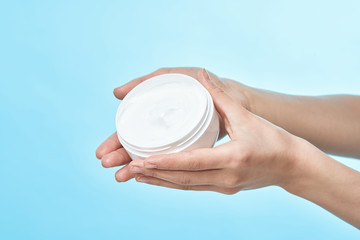 hand holding a glass of milk isolated on white