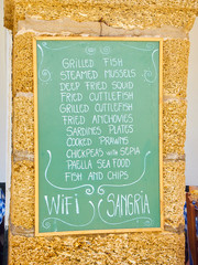 A blackboard offering typical Andalusian food. Cadiz. Andalusia, Spain.