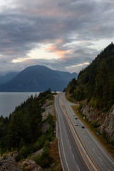 Beautiful Aerial View of Sea to Sky Highway in Howe Sound during a colorful summer sunset. Taken North of Vancouver, British Columbia, Canada.