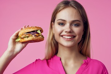 young woman with hamburger