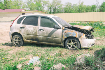 Obraz na płótnie Canvas Burnt car on the street. Side view