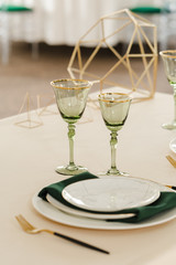Served for wedding restaurant table with dishes, glasses,  cutlery