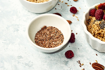 Raw flax seeds in a ceramic cup on the table. Healthy food