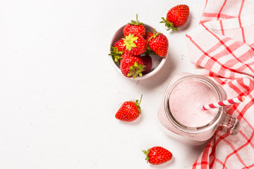 Strawberry milkshake or smoothie in mason jar.