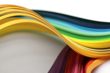 Abstract rainbow gradient color wave curl strip paper background. Soft focus.
