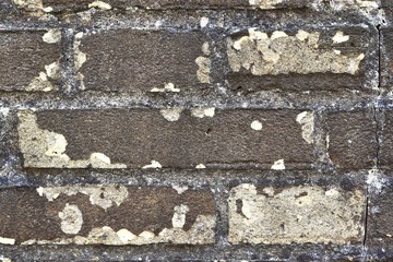 Detailed view on very old weathered brick walls in a grunge vintage look in high resolution