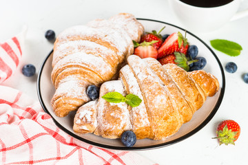 Croissant with chocolate and fresh berries.