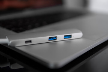 The USB adapter under the Type-C connector for laptop. Multiport station for laptop with multiple different ports. USB to USB Type-C Hub Converter.