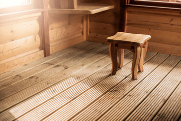 Wooden bench in a wooden hut.