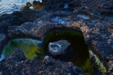 Salt on the rocks on the shores of Ibiza. Surface of mars. Cosmic beauty