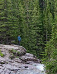 Man Stands At the Edge Of Cliff